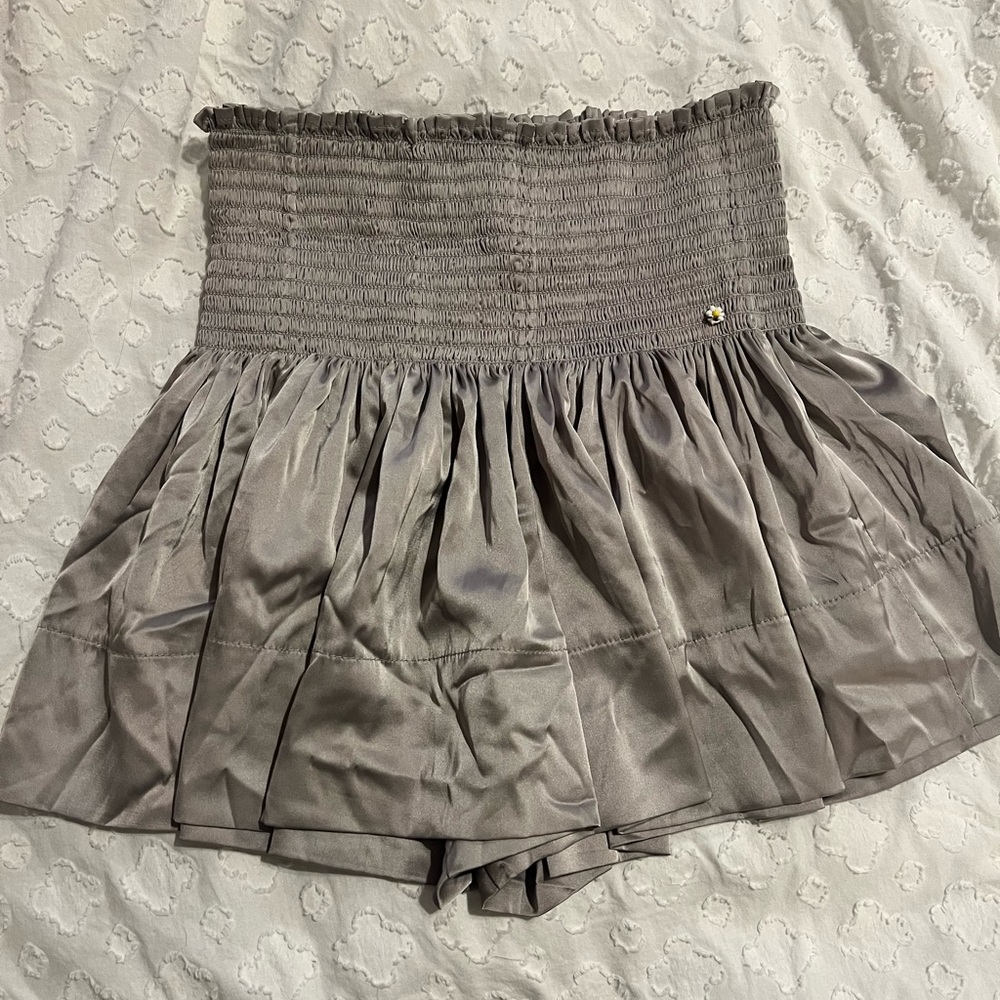 Natural life silver flowy shorts. Never worn size xs.